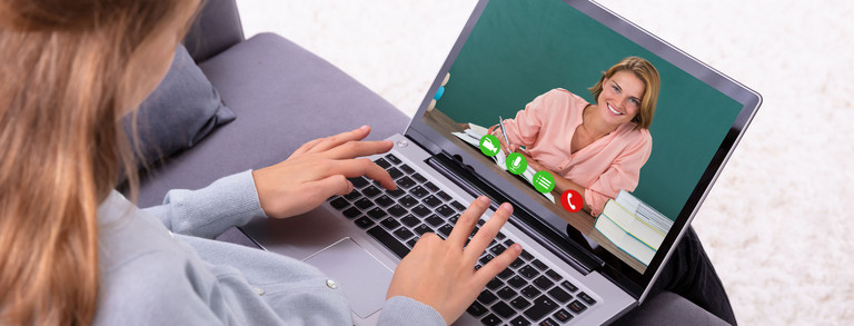 Woman with laptop is having a video call